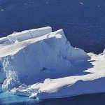 Icebergs that break off glaciers shed debris that settles on the bottom of the ocean floors and creates the layers of sediment cores, a time machine of clues to reconstruct past climate. (NASA)